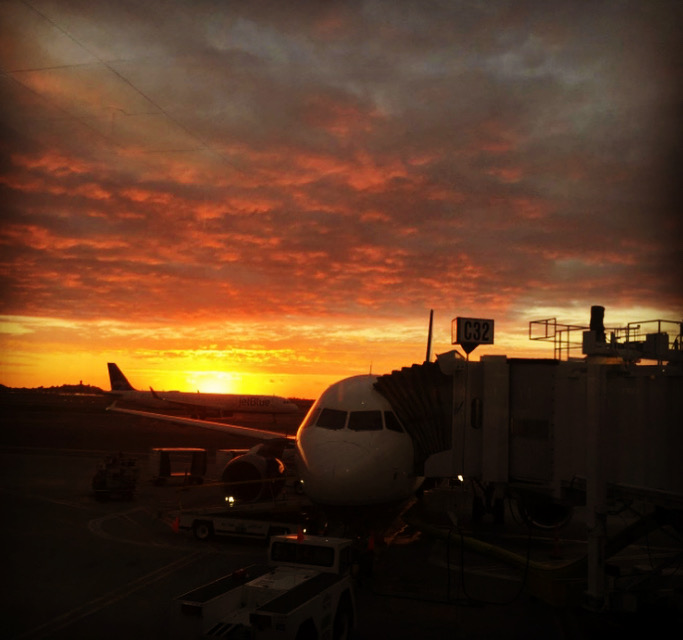 Sunrise, plane, terminal of Logan Airport Boston